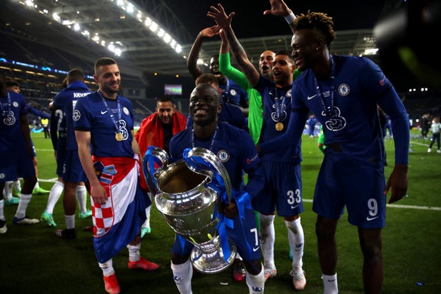 Man of the match N'Golo Kante lifts the trophy 