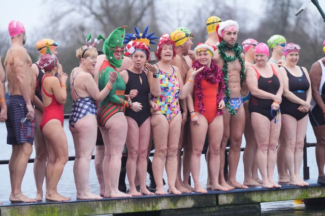 Swimmers prepare to dive in