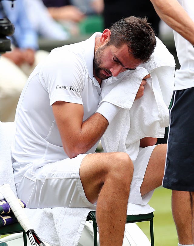 Marin Cilic wipes away tears during his Wimbledon final loss to Roger Federer