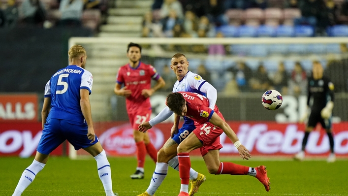 Blackburn Rovers’ George Hirst (right) and Wigan Athletic’s Max Power battle for the ball during the Sky Bet Championship match at the DW Stadium, Wigan. Picture date: Tuesday October 11, 2022.