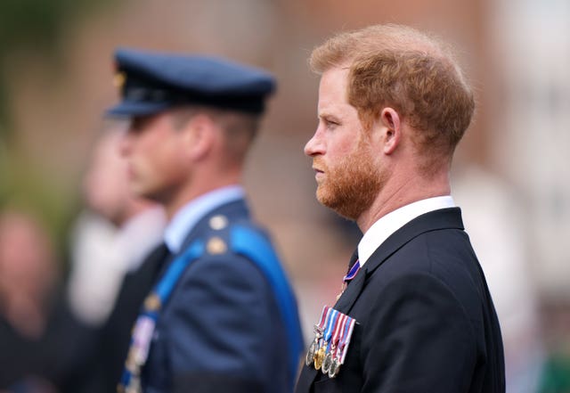 The Prince of Wales and the Duke of Sussex, in the Ceremonial Procession following the Queen's State Funeral at Westminster Abbey on September 19, 2022