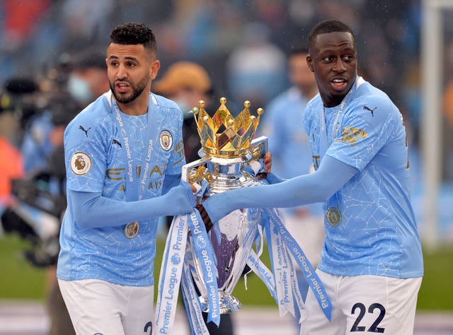 Riyad Mahrez, left, and Benjamin Mendy celebrate the Premier League title