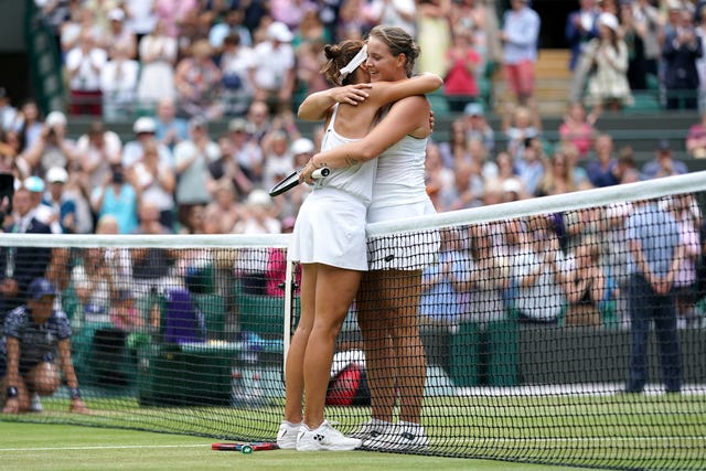 Mum-of-two Tatjana Maria (left) hugs fellow German Jule Niemeier after beating her in three sets to reach the semi-finals