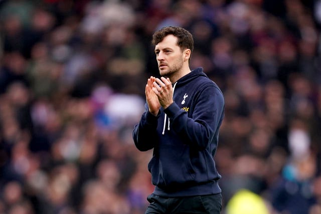 Tottenham interim manager Ryan Mason applauds the fans 