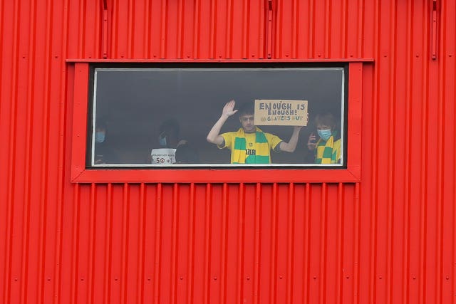 A Manchester United fan protesting inside Old Trafford