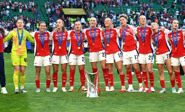 Arsenal players form a huddle around the trophy following victory in the UEFA Women’s Champions League final at Estadio Jose Alvalade, in Lisbon, Portugal. Picture