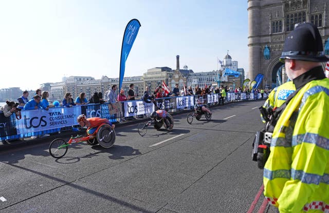 Wheelchair competitors and spectators on the London Marathon route