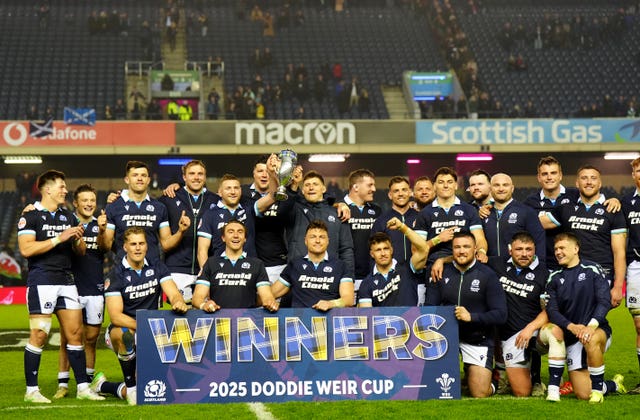 Scotland players celebrate with the Doddie Weir Cup following the Six Nations match the Murrayfield