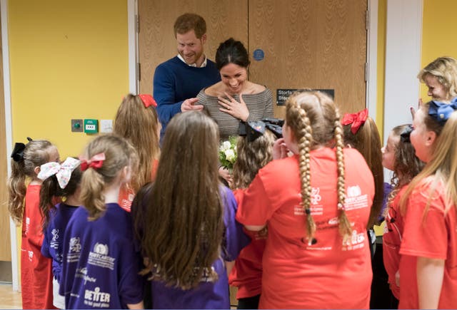 Harry and Meghan meet children during a visit to Star Hub in Tremorfa, Cardiff