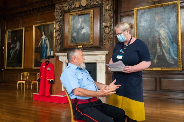 Chelsea Pensioner John Byrne talks to Deputy Chief Nurse Vanessa Sloane (Dominic Lipinski/PA)