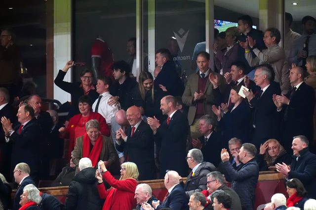The Prince of Wales celebrates Wales’ fourth try of the game in the stands