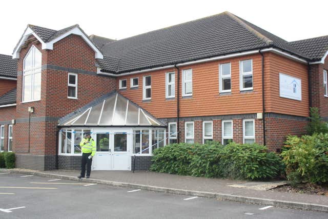 A police officer stands outside Amesbury Baptist Centre