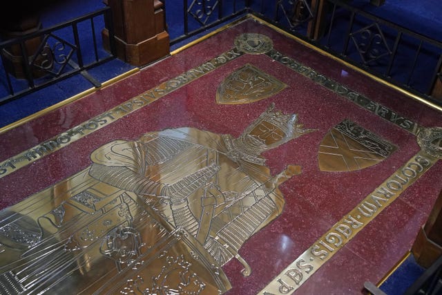 The grave stone of Robert the Bruce, as King Charles III and the Queen Consort visited Dunfermline Abbey, to mark its 950th anniversary, after attending a meeting at the City Chambers in Dunfermline, Fife, where the King formally marked the conferral of city status on the former town