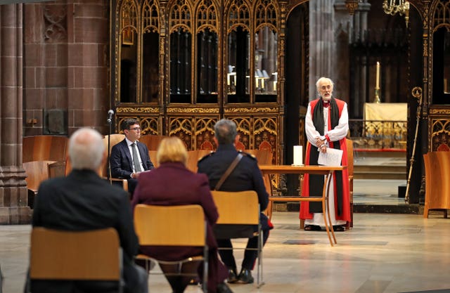 Dr David Walker, Bishop of Manchester leads a memorial service for the victims of coronavirus at Manchester Cathedral, alongside Rt. Hon. Andy Burnham, Mayor of Greater Manchester