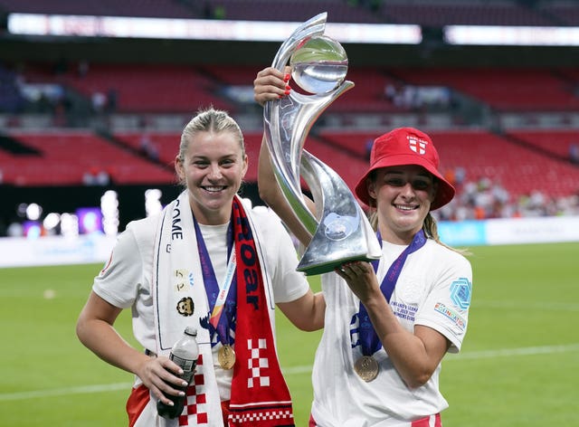 Toone with Alessia Russo (left) and the trophy after England's Euros triumph (Danny Lawson/PA)
