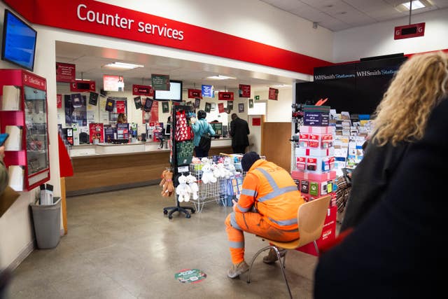 People inside a branch of the Post Office in Paddington, London