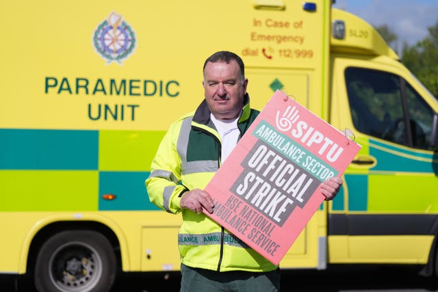 Siptu shop steward Donal Joyce holding a placard
