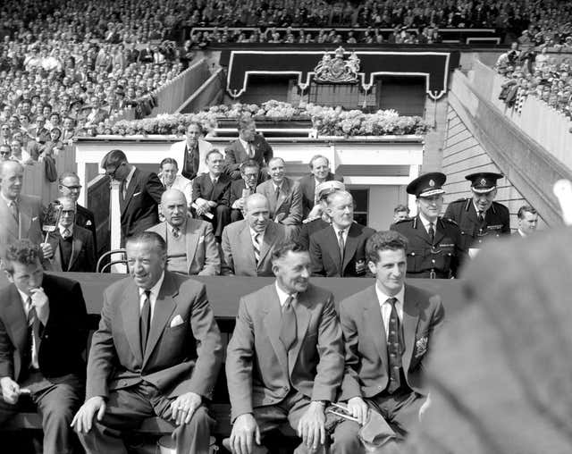 Jimmy Murphy, front left, in the dugout for the 1958 FA Cup final with Matt Busby in the row behind him
