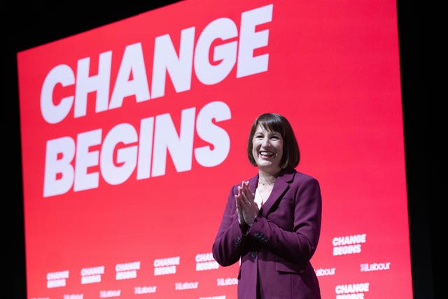 Rachel Reeves smiling, with signage behind her reading 'Change begins'