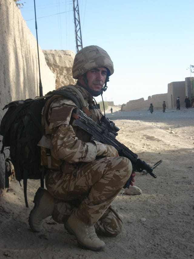 Andy Reid on patrol in Army uniform 