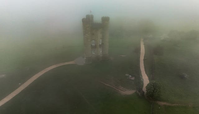 Broadway Tower in the Cotswolds, shrouded in mist on a cloudy day in May