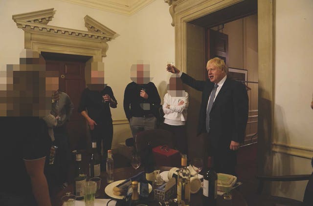 The then-prime minister Boris Johnson (right) at a leaving gathering in the vestibule of the Press Office of 10 Downing Street in November 2020 (Cabinet Office/PA)