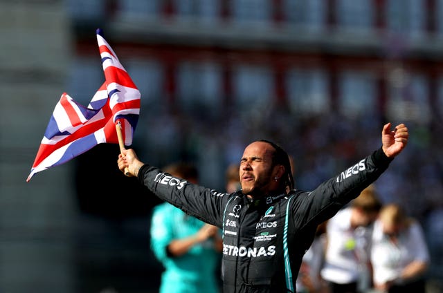 Lewis Hamilton celebrates after winning the British Grand Prix at Silverstone in July. It was his eighth victory on home soil and he went on to claim an eighth world title after a thrilling climax to the season in Abu Dhabi 