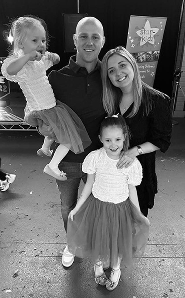 Elsie Dot Stancombe with mother Jenni, father David and younger sister Rosie, aged three