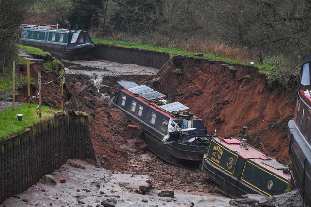 The scene in Whitchurch, Shropshire, with stricken boats in the middle of a sinkhole