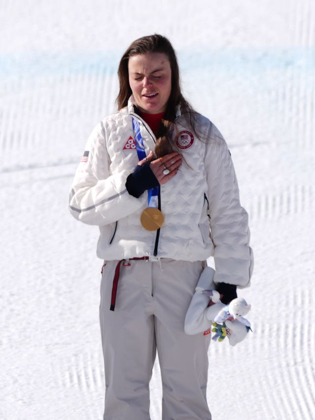 Breezy Johnson on the podium following her Olympic downhill win