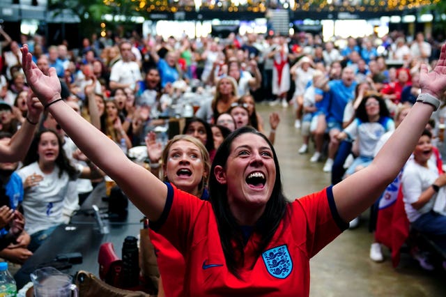 England fans celebrates the third England goal