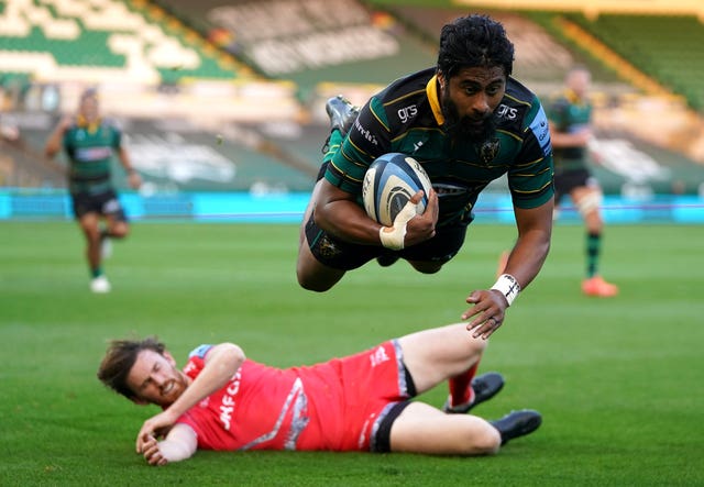 Ahsee Tuala dives over for Northampton's first try