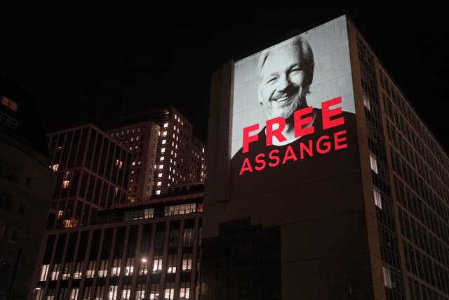 An image of Julian Assange is projected onto a building in Leake Street in central London, to mark three years since his arrest and detention in Belmarsh prison while the United States continues with legal moves to extradite him. 