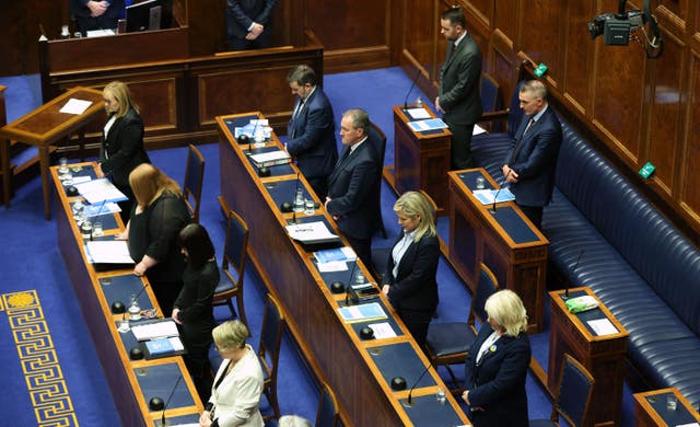 Ministers taking part in a minute’s silence in the Northern Ireland Assembly chamber at Stormont before the delivery of the long-awaited public apology to the victims of historical institutional abuse