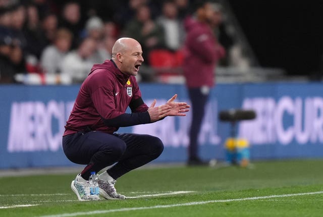 Lee Carsley crouches down on the touchline at Wembley