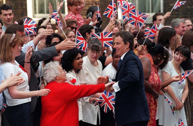 Tony Blair in Downing Street surrounded by supporters waving Union Jacks following the 1997 general election
