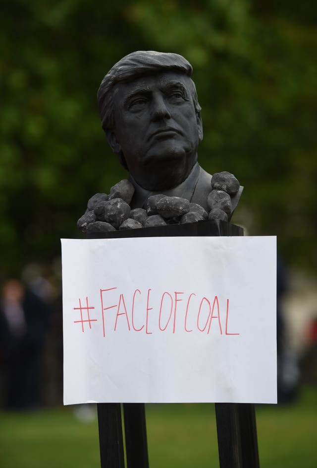 Protesters displayed a bust of Donald Trump outside Buckingham Palace