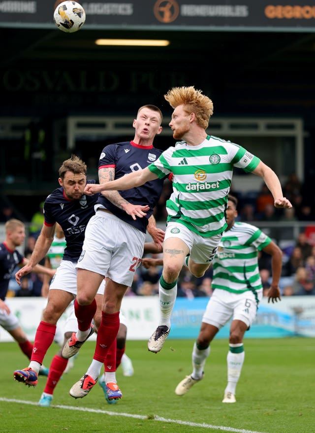 Celtic’s Liam Scales attempts a header during a William Hill Premiership clash with Ross County