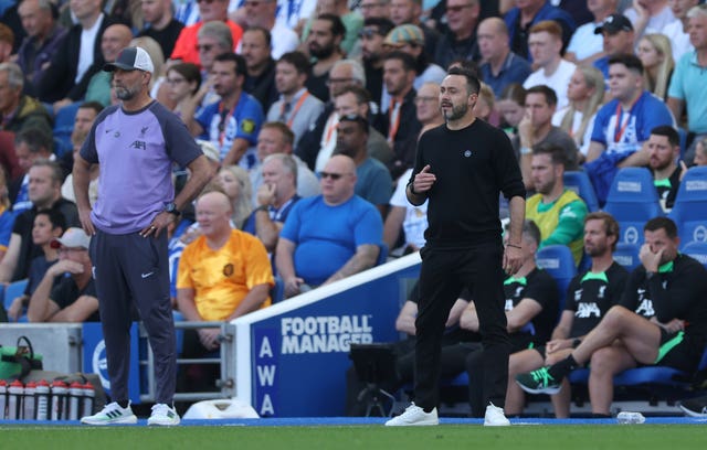 Brighton manager Roberto De Zerbi, right, and Liverpool manager Jurgen Klopp on the touchline