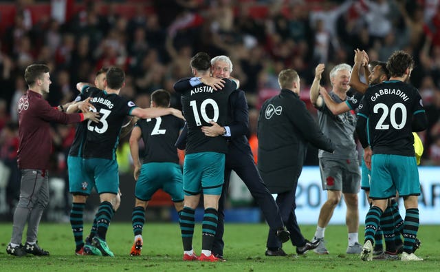 Mark Hughes celebrates with Charlie Austin after the final whistle (Simon Cooper/Empics)