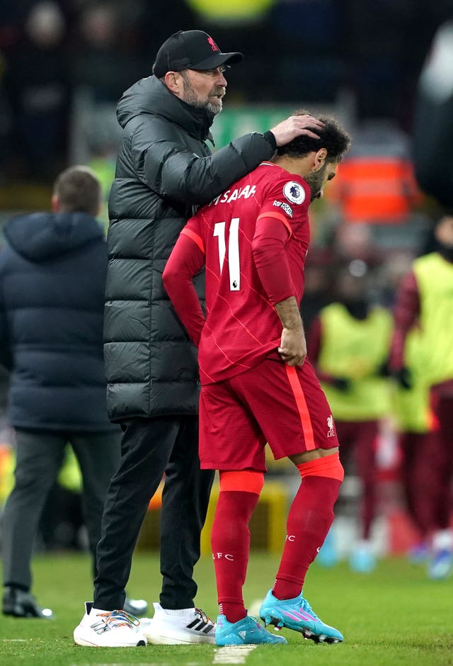 Liverpool manager Jurgen Klopp consoles Mohamed Salah