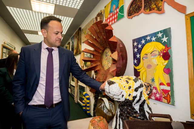 Leo Varadkar inspects an art project during a visit to Newbridge Integrated College (Liam McBurney/PA)