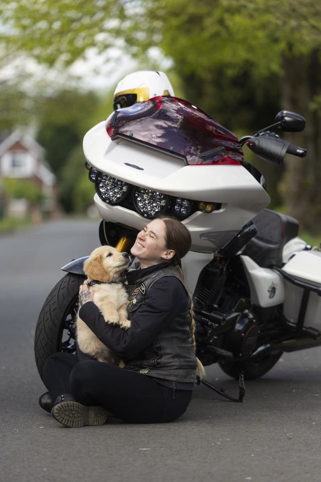 Golden retriever puppy Kian meets Harley-Davidson rider Emma Poole, as the charity Guide Dogs appeals for more motorbike riders to volunteer as puppy raisers