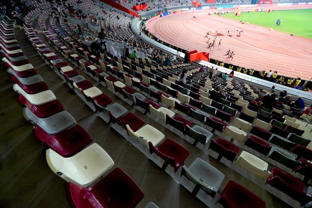 The Women's 200 metres heats take place in front of banks of empty seats 