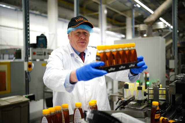Prime Minister Boris Johnson during a visit to Hilltop Honey in Newtown, Powys
