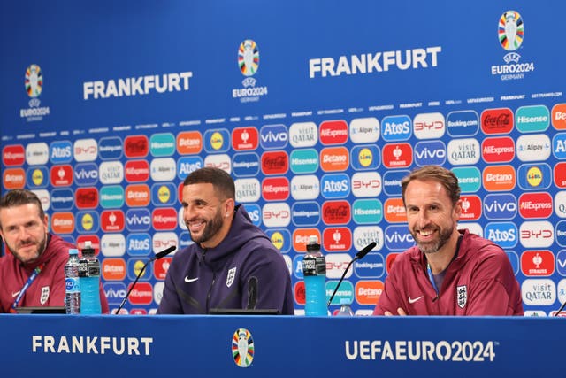 Kyle Walker sat smiling next to Gareth Southgate at England's pre-match press conference