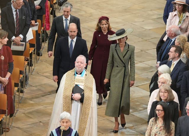 The prince and princess walk through the Nave to their seats