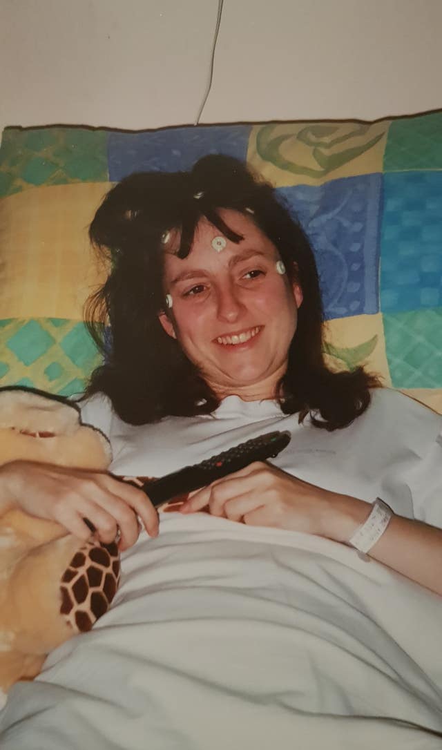 Jayne Sweeney lies in a hospital bed as an 18-year-old in 2001