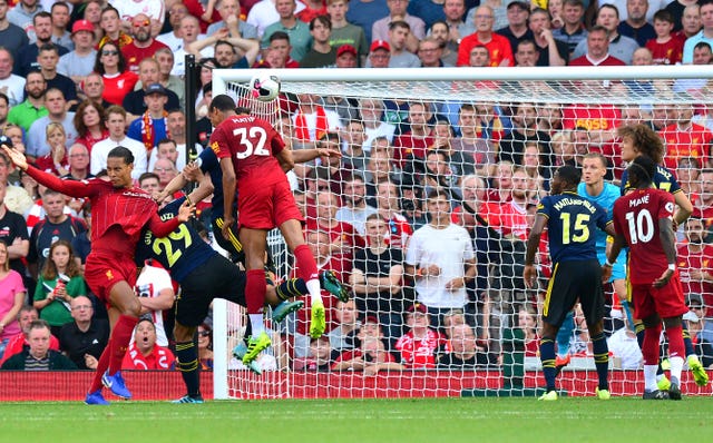 Joel Matip heads in the opener as Liverpool beat Arsenal 3-1 to maintain their winning start to the season