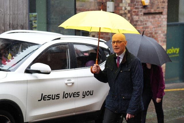 SNP leader John Swinney was also under an umbrella when he arrived at the Moon Tell Me Truth Exhibition, a collection of poems from children in Gaza, at the Scottish Poetry Library in Edinburgh